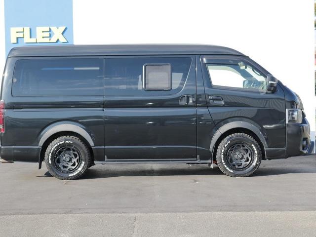 ハイエースバン スーパーGL ダークプライムII フルカスタムオフロードスタイル ユーアイショック&スタビライザー ビックXナビ&フリップダウンモニター シートカバー 片側跳ね上げベットキット 床板パネル 網戸 NT-1アルミ TRタイヤ(6枚目)