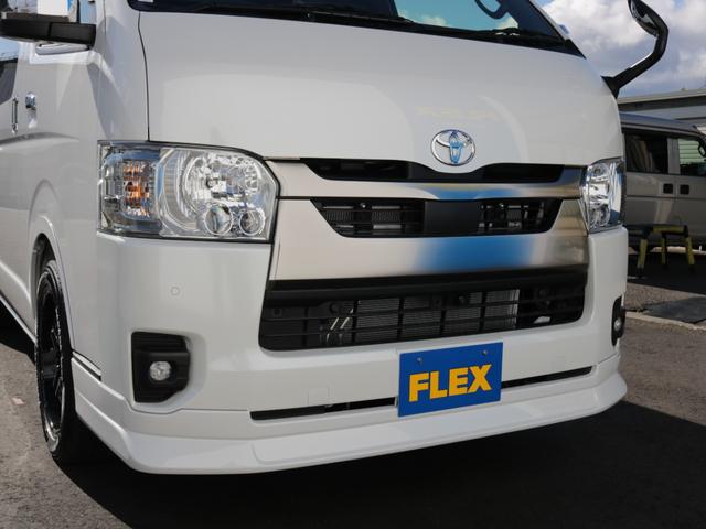 ハイエースバン ロングスーパーGL ダークプライムS 登録済み未使用車ダークプライムS ビックX11インチデカナビ ETC 両側パワースライドドア ベットキット デルフ06アルミホイル18インチ パラダタイヤ オメガLEDテール(65枚目)