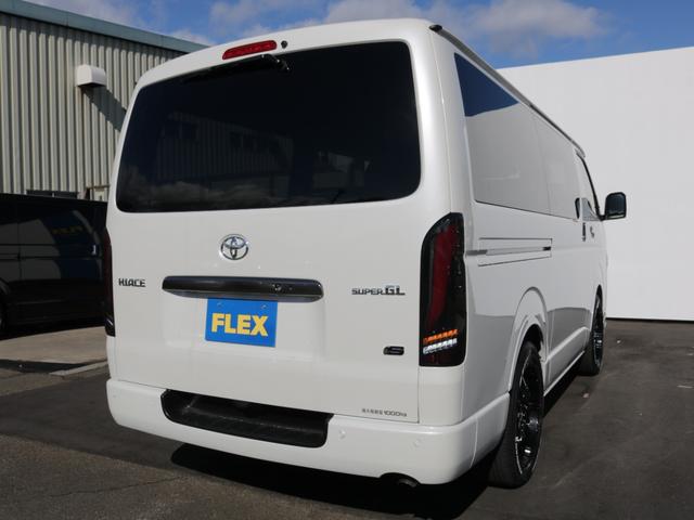 ハイエースバン ロングスーパーGL ダークプライムS 登録済み未使用車ダークプライムS ビックX11インチデカナビ ETC 両側パワースライドドア ベットキット デルフ06アルミホイル18インチ パラダタイヤ オメガLEDテール(70枚目)