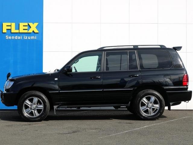 ランドクルーザー１００ ＶＸリミテッド　ブラックカラー全塗装済み　マルチレスナビ　社外ウッドステアリング　シグナス純正１８インチＡＷ　グッドイヤー２７５タイヤ　社外ヘッドライト　社外フォグランプ　社外メッキグリル　社外テールランプ（18枚目）