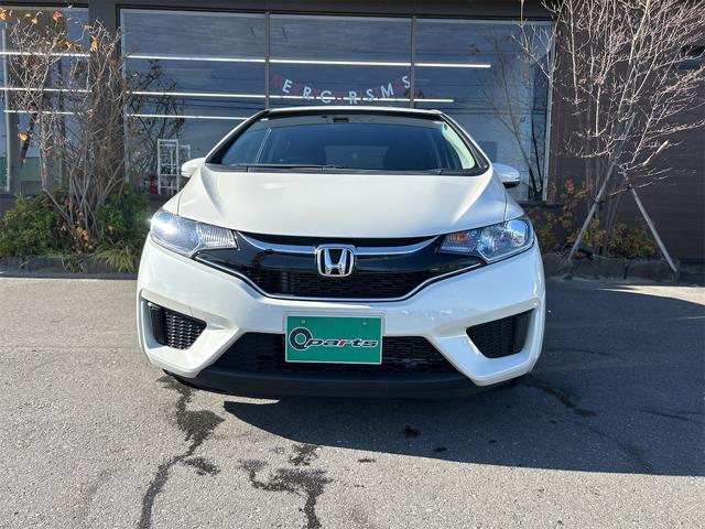 フィット １３Ｇ・Ｆパッケージ　ＥＴＣ　ナビ　衝突被害軽減システム　アルミホイール　スマートキー　アイドリングストップ　電動格納ミラー　フルフラット　ＣＶＴ　盗難防止システム　衝突安全ボディ　ＡＢＳ　ＥＳＣ　ＵＳＢ（2枚目）