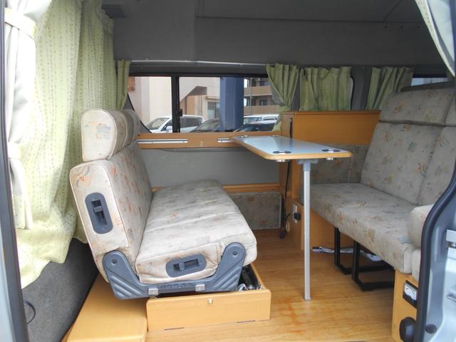 ハイエースバン SロングワイドDX GLパッケージ 4WD キャンピング ナビ バックカメラ べバストFFヒーター 外部電源入力可 AC100Vコンセント&ソケット サブバッテリー シンク 排水給水 シャワー付き テーブル&ソファー 網戸 カーテン(2枚目)