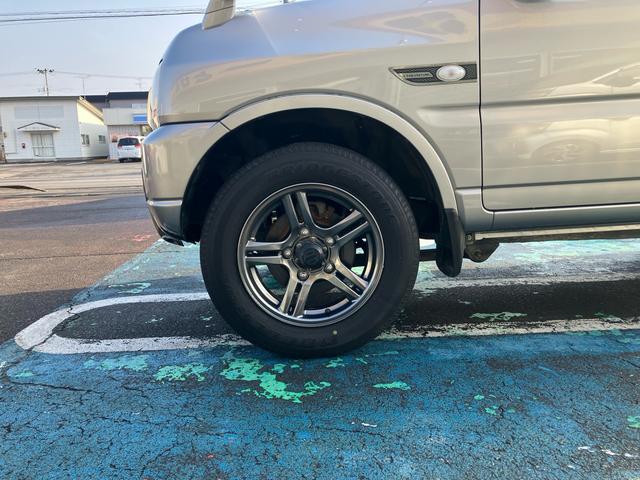 ジムニー ランドベンチャー　４ＷＤ　５速マニュアル　オプションカラー　特別仕様車　ハーフレザーシート　フルセグナビ　シートヒーター　ミラーヒーター　背面タイヤハードカバー　純正１６インチアルミホイール　クロムメッキバンパーカバー（53枚目）