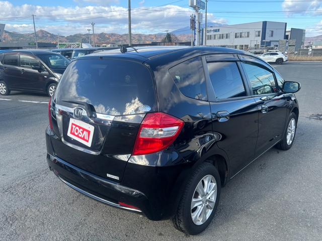 フィット １５ＸＨ　ファインスタイル　４ＷＤ　ケンウッド製ナビ　ブラウン合皮シート　シートヒーター　スマートキー　クルーズコントロール　純正革巻きステアリング　ＨＩＤヘッド　オートライト　オートエアコン　純正１５インチアルミ　盗難防止装置（18枚目）