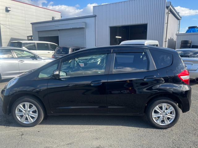 フィット １５ＸＨ　ファインスタイル　４ＷＤ　ケンウッド製ナビ　ブラウン合皮シート　シートヒーター　スマートキー　クルーズコントロール　純正革巻きステアリング　ＨＩＤヘッド　オートライト　オートエアコン　純正１５インチアルミ　盗難防止装置（21枚目）