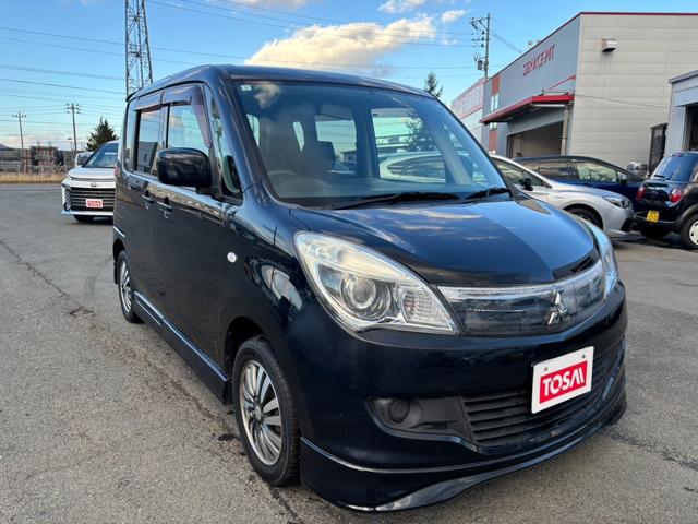 デリカＤ：２ Ｘ　片側パワースライドドア　エクリプス製メモリーナビ　バックカメラ　シートヒーター　スマートキー　プライバシーガラス　オートエアコン　リアヒーターダクト　ヒーテッドドアミラー　純正１４インチアルミ（16枚目）