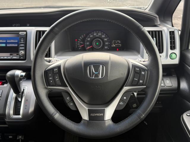 ステップワゴンスパーダ Ｚ　インターナビセレクション　フリップダウンモニター　両側電動スライドドア　寒冷地仕様　純正ＨＤＤナビ　バックカメラ　ＥＴＣ　クルーズコントロール　ＨＩＤヘッドライト　スマートキー　フルセグＴＶ　ＣＤ／ＤＶＤ　ステアリングスイッチ（13枚目）