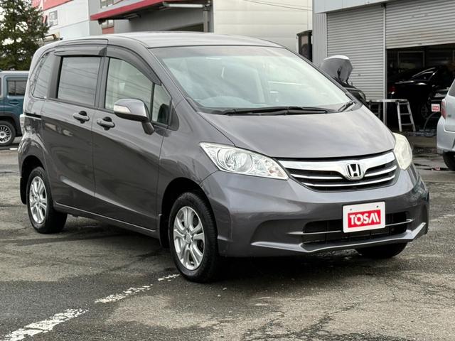 フリード Ｇ　ジャストセレクション＋　４ＷＤ　両側電動スライドドア　純正メモリーナビ　バックカメラ　合皮レザーシート　ＨＩＤヘッド　オートライト　１５インチアルミ　オートエアコン　ステアリングスイッチ　ＥＴＣ　コンフォートビューパッケージ（19枚目）