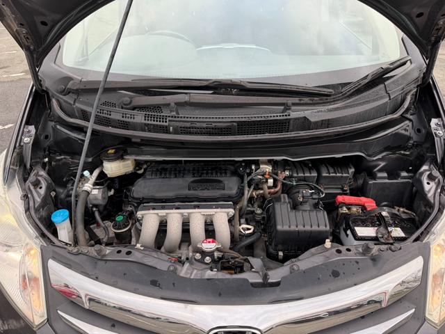 フリード Ｇ　ジャストセレクション＋　４ＷＤ　両側電動スライドドア　純正メモリーナビ　バックカメラ　合皮レザーシート　ＨＩＤヘッド　オートライト　１５インチアルミ　オートエアコン　ステアリングスイッチ　ＥＴＣ　コンフォートビューパッケージ（21枚目）