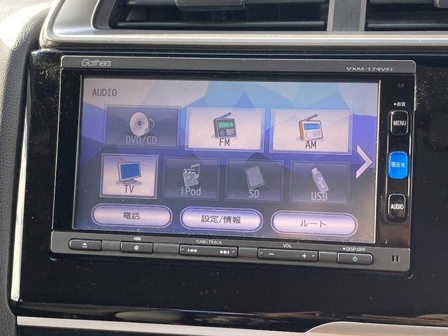 フィット 13G・F 4WD 純正SDナビ フルセグ バックカメラ DVD再生 横滑り防止 社外15インチアルミ スマートキー ETC オートリトラミラー ステアリングリモコン(5枚目)