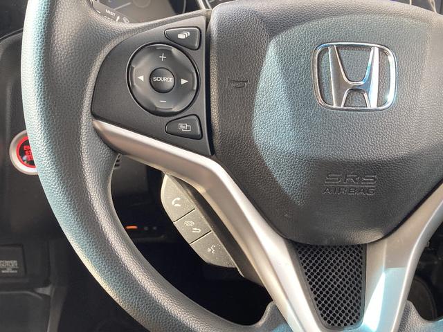 フィット 13G・F 4WD 純正SDナビ フルセグ バックカメラ DVD再生 横滑り防止 社外15インチアルミ スマートキー ETC オートリトラミラー ステアリングリモコン(9枚目)