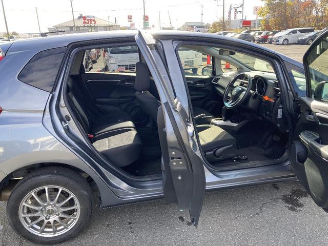 フィット 13G・F 4WD 純正SDナビ フルセグ バックカメラ DVD再生 横滑り防止 社外15インチアルミ スマートキー ETC オートリトラミラー ステアリングリモコン(34枚目)