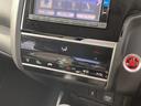 フィット 13G・F 4WD 純正SDナビ フルセグ バックカメラ DVD再生 横滑り防止 社外15インチアルミ スマートキー ETC オートリトラミラー ステアリングリモコン(7枚目)
