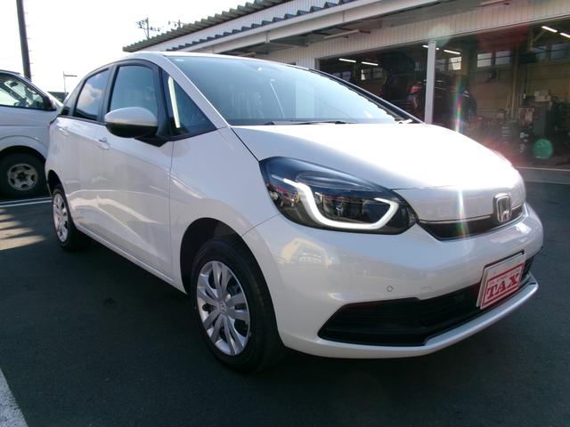 フィット ｅ：ＨＥＶホーム　４ＷＤ　ＬＫＡＳ　ＶＳＡ　オートマチックハイビーム　サイドカーテンエアバック　衝突安全ボディ　前後ソナー　スマートキ　ＥＣＯＮモード　踏み間違い防止　盗難防止装置　クルコン　パワーウィンドウ（9枚目）