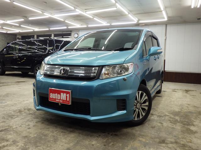 フリードスパイクハイブリッド ジャストセレクション MOPHDDナビ 地デジチューナーフルセグ バックカメラ 両側パワスラ オートクルーズ ETC 純正15インチAW スタッドレス社外AWセット付属 HID ハーフレザーシート ミラーヒーター 禁煙車(5枚目)