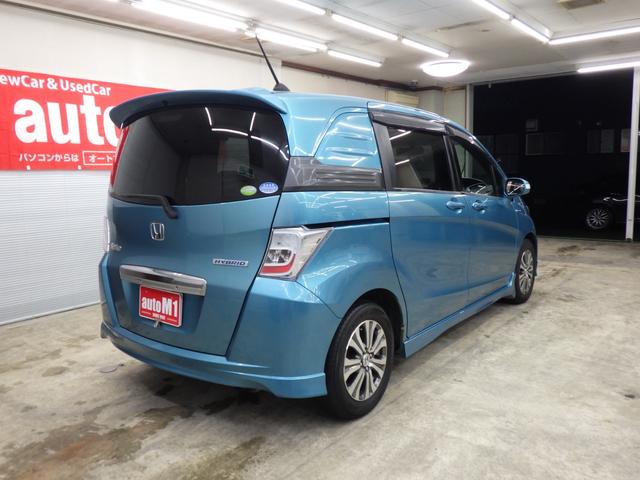 フリードスパイクハイブリッド ジャストセレクション MOPHDDナビ 地デジチューナーフルセグ バックカメラ 両側パワスラ オートクルーズ ETC 純正15インチAW スタッドレス社外AWセット付属 HID ハーフレザーシート ミラーヒーター 禁煙車(8枚目)