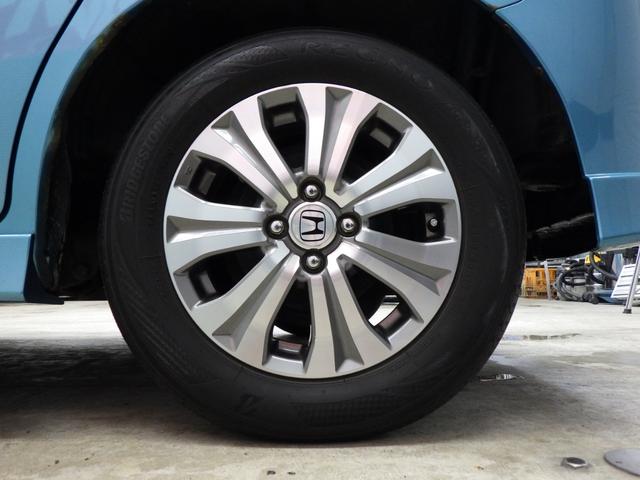 フリードスパイクハイブリッド ジャストセレクション MOPHDDナビ 地デジチューナーフルセグ バックカメラ 両側パワスラ オートクルーズ ETC 純正15インチAW スタッドレス社外AWセット付属 HID ハーフレザーシート ミラーヒーター 禁煙車(64枚目)