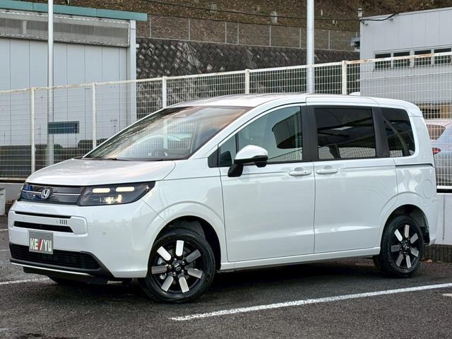 フリード ｅ：ＨＥＶエアー　ＥＸ【４ＷＤ／登録済み未使用車／６人乗り】　【１１．４型ナビ／ホンダセンシング／マルチビューカメラ】【ＥＴＣ２．０／ＬＥＤヘッドライト／ワイパー熱線】【フルセグＴＶ／ＢＴ接続】【電動パーキング／ブレーキホールド】【シートヒーター／ハーフレザー】（56枚目）