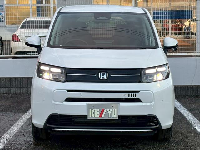 フリード ｅ：ＨＥＶエアー　ＥＸ【４ＷＤ／登録済み未使用車／６人乗り】　【１１．４型ナビ／ホンダセンシング／マルチビューカメラ】【ＥＴＣ２．０／ＬＥＤヘッドライト／ワイパー熱線】【フルセグＴＶ／ＢＴ接続】【電動パーキング／ブレーキホールド】【シートヒーター／ハーフレザー】（57枚目）