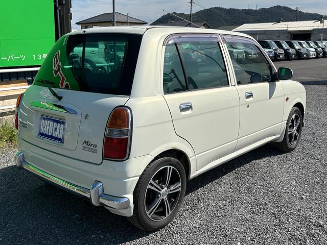 ミラジーノ ジーノターボ　ターボ　４ＷＤ　ナビ　ＴＶ　パワーステアリング　エアコン　パワーウインドウ　助手席エアバッグ　運転席エアバッグ　電動格納ミラー　キーレス　ＵＳＢ（5枚目）