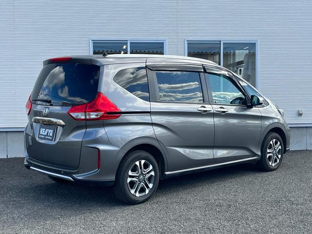 フリードハイブリッド ハイブリッド・クロスターホンダセンシング【4WD】純正ナビ 【衝突軽減システム】【追従クルーズコントロール】【両側電動スライドドア】【エンジンスターター】【バックカメラ】【ビルトインETC】【前後ドラレコ】【純正15インチアルミ】【LEDヘッドライト/フォグ】(4枚目)