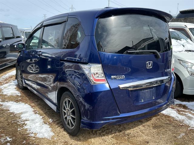 フリードハイブリッド ジャストセレクション　ナビ　オートクルーズコントロール　両側電動スライドドア　オートライト　ＨＩＤ　スマートキー　電動格納ミラー　ＣＶＴ　アルミホイール　盗難防止システム　ＡＢＳ　ＥＳＣ　エアコン　パワーステアリング（2枚目）