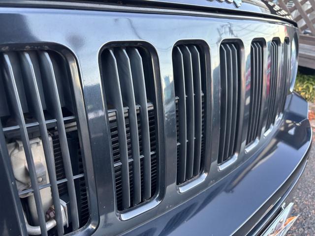 ジープ・パトリオット リミテッド　サンルーフ　ハーフレザーシート　前席シートヒーター　クルーズコントロール　ＥＴＣ　純正ＡＷ　キーレス　フォグ　純正オーディオ　禁煙　ドアバイザー　サイドカメラ（25枚目）