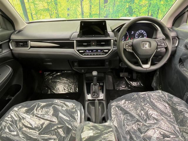 WR-V Z 登録済未使用車 ホンダセンシング レーダークルーズ ハーフレザーシート スマートキー LEDヘッド オートハイビーム 車線逸脱警報 誤発進抑制機能 オートライト オートエアコン 純正17インチAW(2枚目)