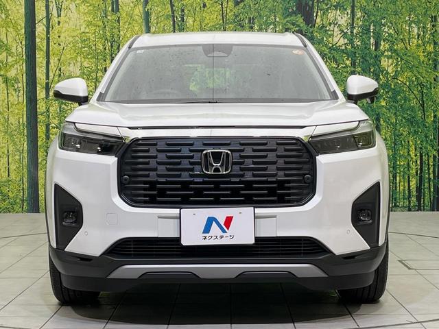 WR-V Z 登録済未使用車 ホンダセンシング レーダークルーズ ハーフレザーシート スマートキー LEDヘッド オートハイビーム 車線逸脱警報 誤発進抑制機能 オートライト オートエアコン 純正17インチAW(14枚目)