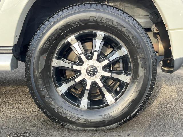 パジェロ ロング スーパーエクシード 4WD 7人乗り 禁煙車 純正7インチナビ 本革シート バックカメラ ETC Bluetooth フルセグ 前席シートヒーター 前席パワーシート HIDヘッドライト LEDフォグライト クルコン(27枚目)