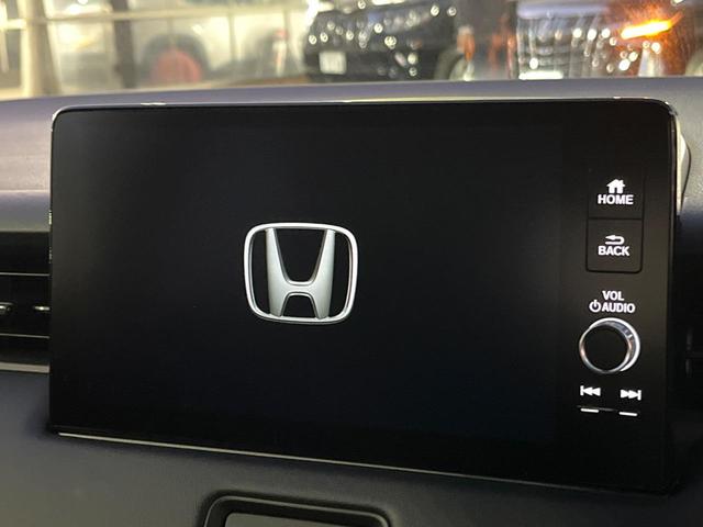 ヴェゼル ｅ：ＨＥＶ　Ｚ　登録済未使用車　衝突被害軽減システム　純正９インチナビ　全周囲カメラ　ＥＴＣ　電動リアゲート　ハーフレザーシート　ＬＥＤヘッド　コーナーセンサー　スマートキー　純正１８インチアルミ　オートハイビーム（3枚目）