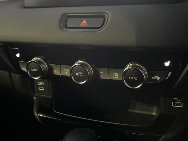 ヴェゼル ｅ：ＨＥＶ　Ｚ　登録済未使用車　衝突被害軽減システム　純正９インチナビ　全周囲カメラ　ＥＴＣ　電動リアゲート　ハーフレザーシート　ＬＥＤヘッド　コーナーセンサー　スマートキー　純正１８インチアルミ　オートハイビーム（65枚目）