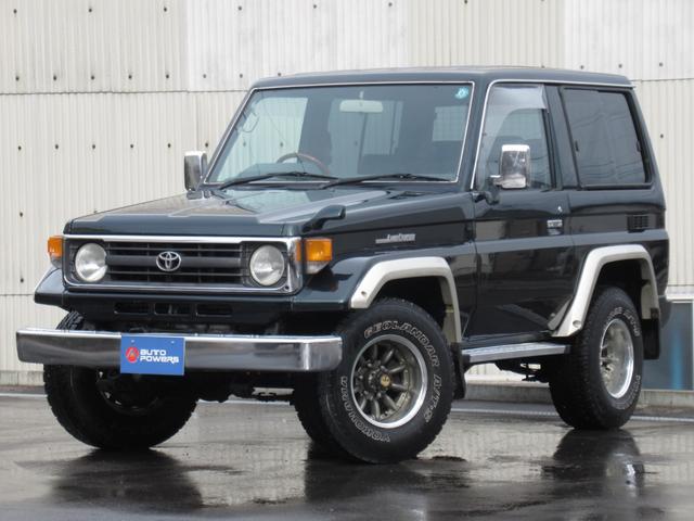 ランドクルーザー70 LXショートナローボディー 5速マニュアル 前後リーフ型 マニュアルハブ メッキバンパー 社外15インチアルミホイール ヨコハマジオランダーA/T・S 純正ダークグリーン色 ケンウッドSDナビ フルセグテレビ Bluetooth(2枚目)