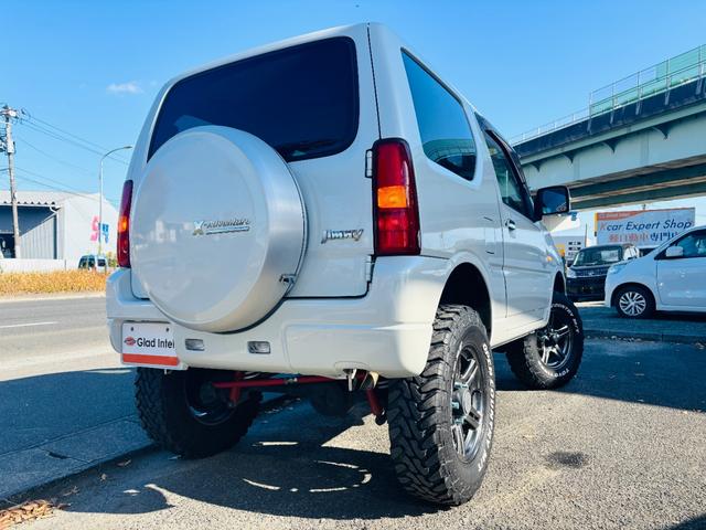 ジムニー クロスアドベンチャー 4WD/ターボ車両/マニュアル/リフトアップ/Bluetooth対応社外ナビTV/バックカメラ/シートヒーター/カスタムシフトレバー/マッドタイヤ装着/LEDフォグランプ/純正16インチアルミホイール(10枚目)