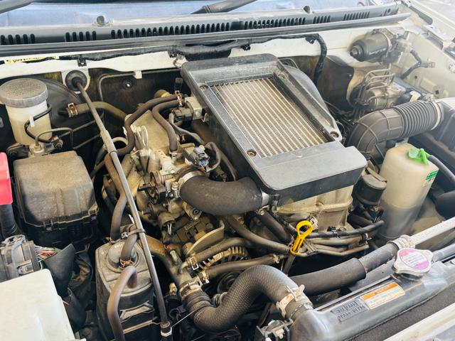 ジムニー クロスアドベンチャー 4WD/ターボ車両/マニュアル/リフトアップ/Bluetooth対応社外ナビTV/バックカメラ/シートヒーター/カスタムシフトレバー/マッドタイヤ装着/LEDフォグランプ/純正16インチアルミホイール(23枚目)