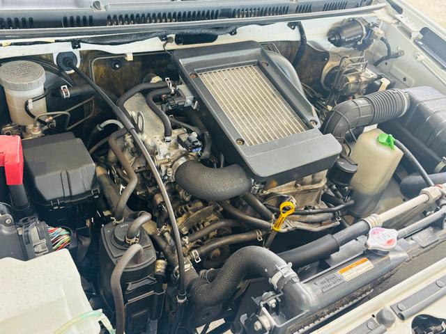 ジムニー クロスアドベンチャー　４ＷＤ／マニュアル車／専用レザー調シート／シートヒーター／社外ＣＤオーディオ／キーレスキー／純正１６インチアルミホイール（23枚目）