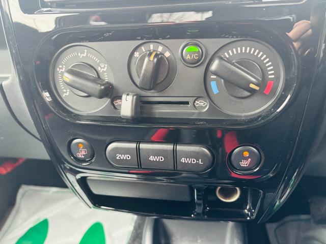 ジムニー クロスアドベンチャー　４ＷＤ／ターボ車／後期型／リフトアップ／マッドタイヤ装着車／キーレスキー／社外ＣＤオーディオ／純正１６インチアルミホイール（22枚目）