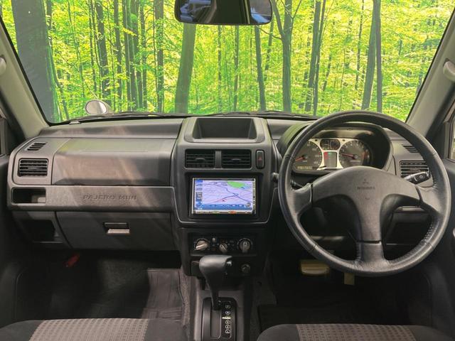 パジェロミニ アクティブフィールドエディション 4WD 純正15インチアルミ CD DVD再生 ナビ 電動格納ミラー プライバシーガラス グレーファブリックコンビシート リアワイパー メッキ加飾付フロントグリル 背面ハードカバー 革巻きステアリング(2枚目)