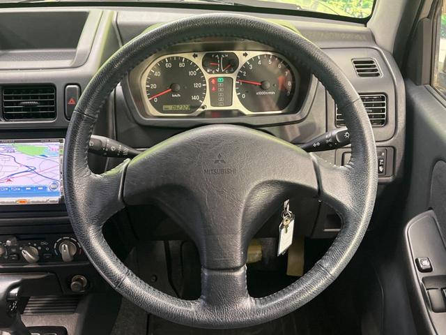 パジェロミニ アクティブフィールドエディション 4WD 純正15インチアルミ CD DVD再生 ナビ 電動格納ミラー プライバシーガラス グレーファブリックコンビシート リアワイパー メッキ加飾付フロントグリル 背面ハードカバー 革巻きステアリング(10枚目)