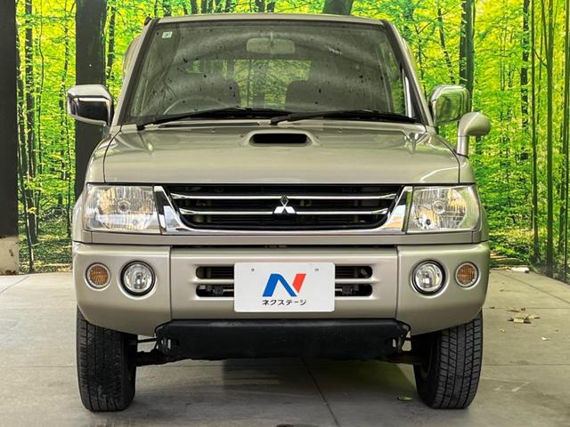 パジェロミニ アクティブフィールドエディション 4WD 純正15インチアルミ CD DVD再生 ナビ 電動格納ミラー プライバシーガラス グレーファブリックコンビシート リアワイパー メッキ加飾付フロントグリル 背面ハードカバー 革巻きステアリング(14枚目)