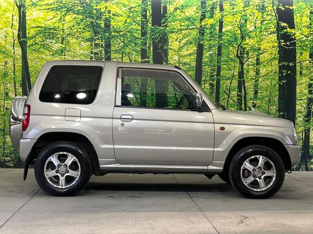 パジェロミニ アクティブフィールドエディション 4WD 純正15インチアルミ CD DVD再生 ナビ 電動格納ミラー プライバシーガラス グレーファブリックコンビシート リアワイパー メッキ加飾付フロントグリル 背面ハードカバー 革巻きステアリング(23枚目)