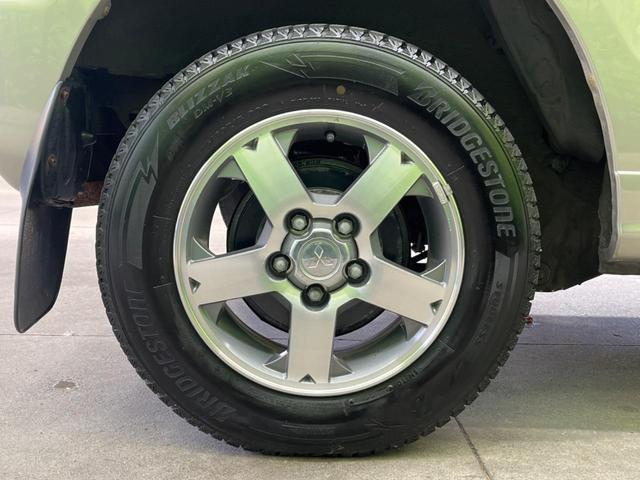 パジェロミニ アクティブフィールドエディション 4WD 純正15インチアルミ CD DVD再生 ナビ 電動格納ミラー プライバシーガラス グレーファブリックコンビシート リアワイパー メッキ加飾付フロントグリル 背面ハードカバー 革巻きステアリング(48枚目)