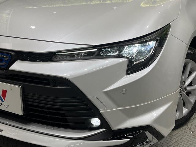 カローラツーリング ハイブリッド G モデリスタエアロ 純正10.5型ナビ バックカメラ ブラインドスポットモニター パーキングサポートブレーキ セーフティセンス レーダークルーズ LEDヘッド スマートキー ETC 革巻きステアリング(12枚目)