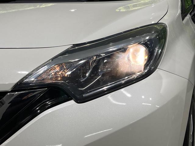 ノート X 後期 純正SDナビ エマージェンシーブレーキ アイドリングストップ インテリキー オートライト シートリフター ステアリングスイッチ プライバシーガラス 電動格納ミラー エアコン 車線逸脱警報 禁煙車(12枚目)