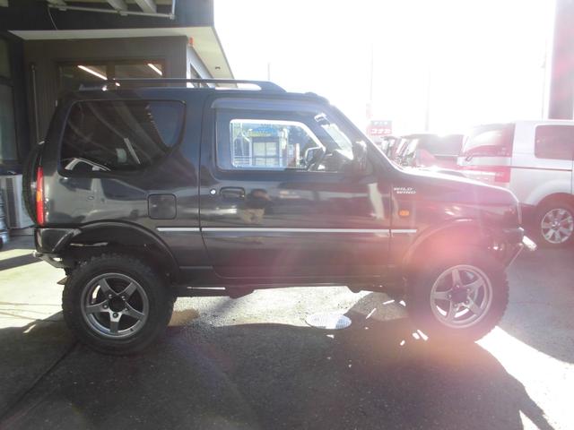 ジムニー ワイルドウインド　特別仕様車　６型　切替式４ＷＤ　オートマ　２インチリフトアップ　社外１６インチアルミホイール＆マッドタイヤ　社外Ｂｌｕｅｔｏｏｔｈ機能付きオーディオ　ルーフレール　シートヒーター　車検令和９年７月（17枚目）