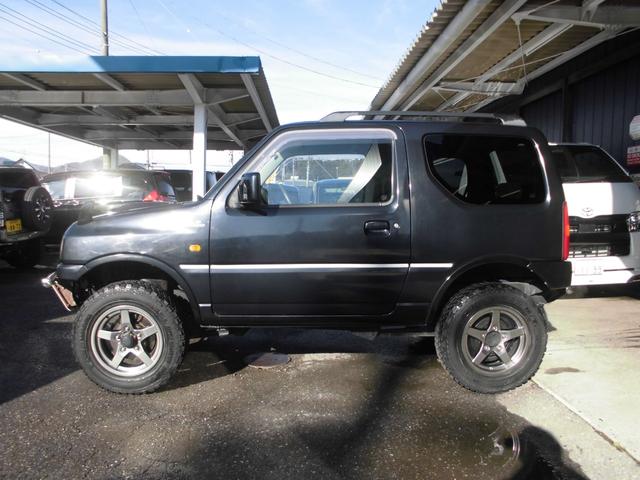 ジムニー ワイルドウインド　特別仕様車　６型　切替式４ＷＤ　オートマ　２インチリフトアップ　社外１６インチアルミホイール＆マッドタイヤ　社外Ｂｌｕｅｔｏｏｔｈ機能付きオーディオ　ルーフレール　シートヒーター　車検令和９年７月（18枚目）