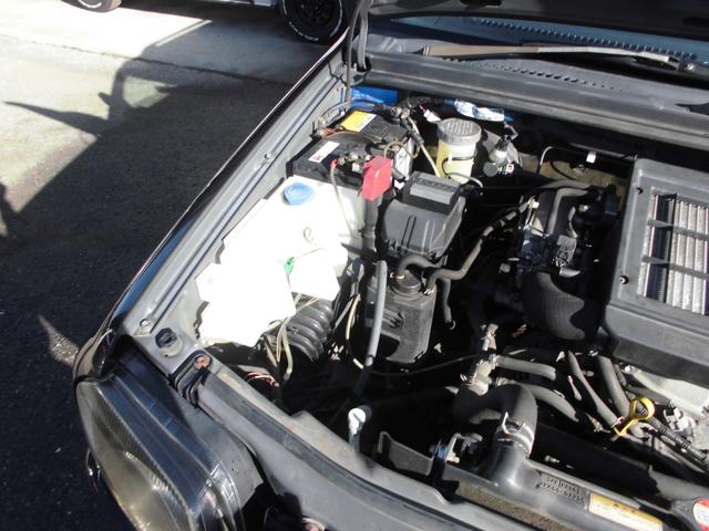 ジムニー ワイルドウインド　特別仕様車　６型　切替式４ＷＤ　オートマ　２インチリフトアップ　社外１６インチアルミホイール＆マッドタイヤ　社外Ｂｌｕｅｔｏｏｔｈ機能付きオーディオ　ルーフレール　シートヒーター　車検令和９年７月（50枚目）