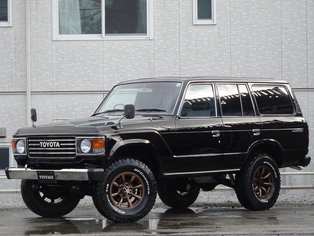 ランドクルーザー60 GX平屋根観音扉5速MTFJ62V新品鍛造17インチホイール新品BFグッドリッチATタイヤ新品グリル新品フロントバンパー新品リアバンパー新品ヘッドライト新品楽々ナビのディスプレイオーディオ西日本仕入(2枚目)