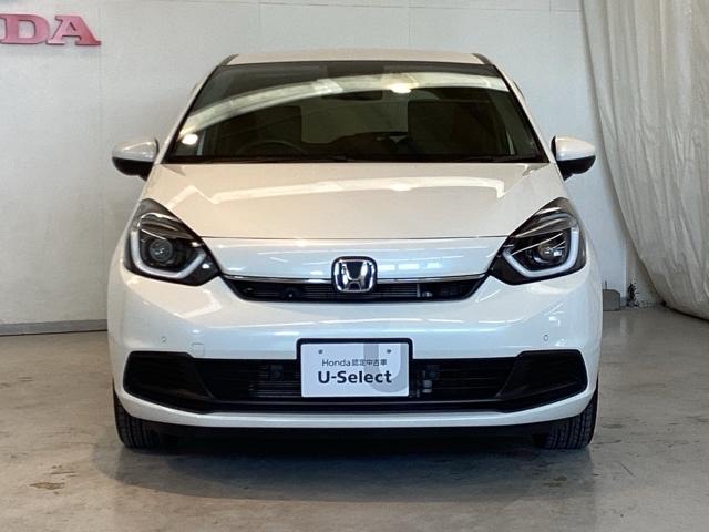 フィット e:HEVホーム 光触媒抗菌消臭施工済 ドラレコ前後 ナビ 障害物センサー ETC 前後誤発進抑制機能 クリソナ 助手席エアバッグ 運転席エアバッグ アイドリングストップ LEDライト USB接続 バックカメラ ABS(2枚目)