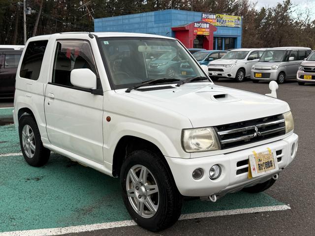 パジェロミニ 切り替え４ＷＤ　アクティブフィールドエディション　ＨＤＤナビ、ＣＤ／ＤＶＤ、ＥＴＣ、電動格納ミラー、キーレスエントリー、アルミホイール付き、（7枚目）